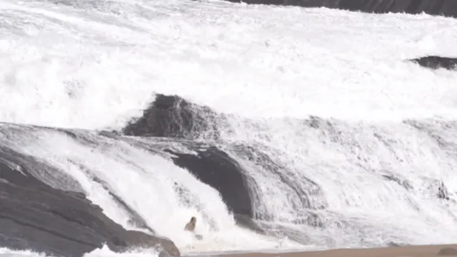 man-escapes-deadly-waves-at-beach-internet-says-yamraj-was-on-leave-viral-video